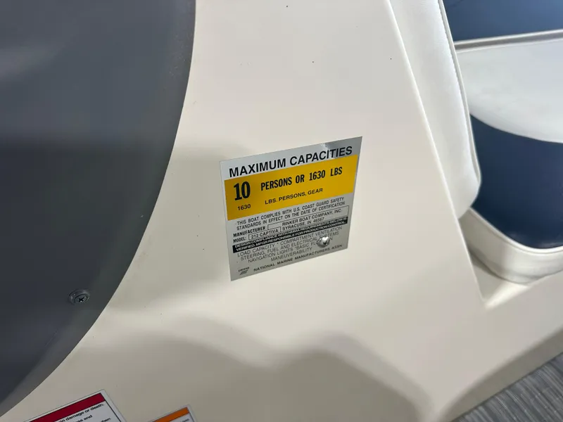 Slide: The Image of 1999 Rinker 212 Bowrider Captiva capacity label, maximum 10 persons or 1630 lbs. - 26