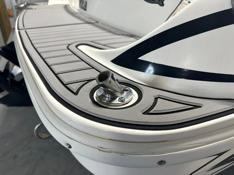 Slide: The Image of 1999 Rinker 212 Bowrider Captiva boat deck with stainless steel fitting. - 30
