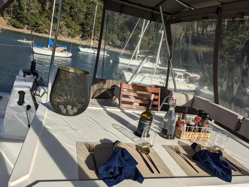 Slide: The Image of Dining setup on a 2021 Bali 4.8 yacht with scenic marina view. - 13