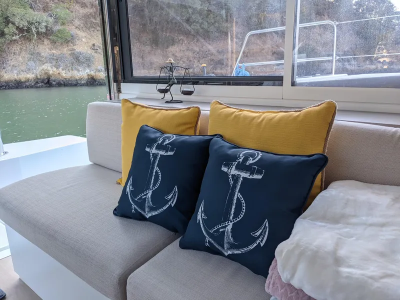 Slide: The Image of Cozy seating area on a 2021 Bali 4.8 yacht with nautical-themed cushions. - 22