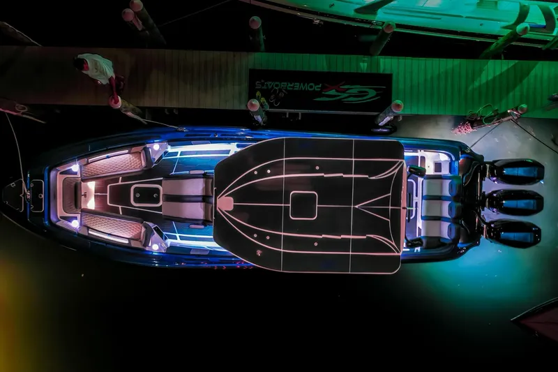 Slide: The Image of 2024 Glasstream GSX 36 boat, aerial view, illuminated at night, docked with triple outboard engines. - 3