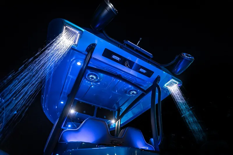 Slide: The Image of 2024 Glasstream GSX 36 boat with illuminated blue lights at night. - 4