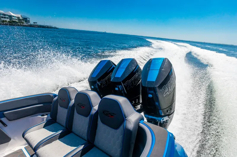 Slide: The Image of 2024 Glasstream GSX 36 boat speeding on water with powerful engines. - 6