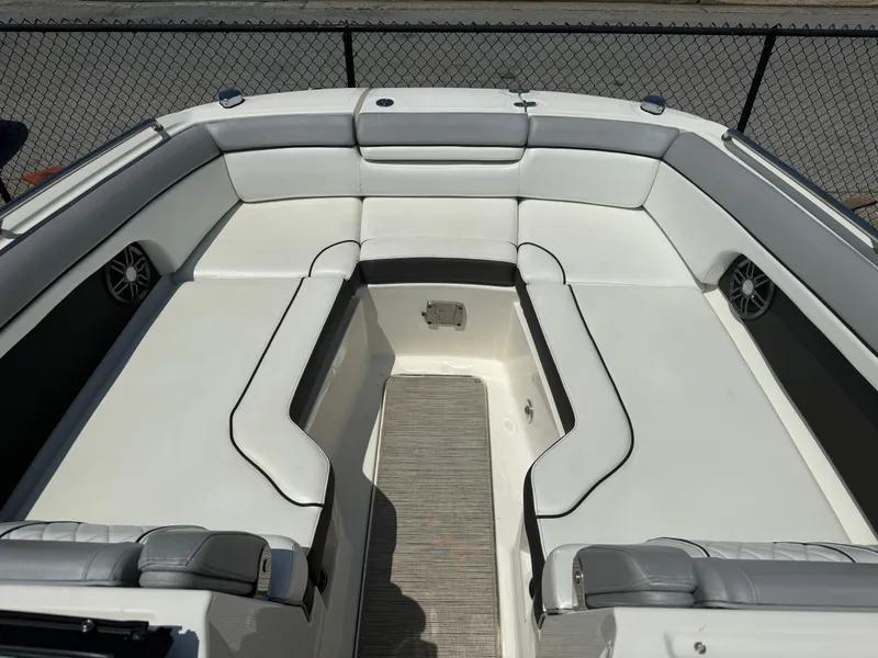 Slide: The Image of 2016 Sea Ray 270 Sundeck interior with white seating and speakers. - 2