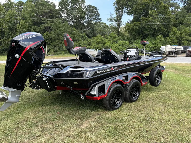 Slide: The Image of 2025 Ranger Z521R Ranger Cup Equipped boat on grass, featuring sleek design and powerful engine. - 10