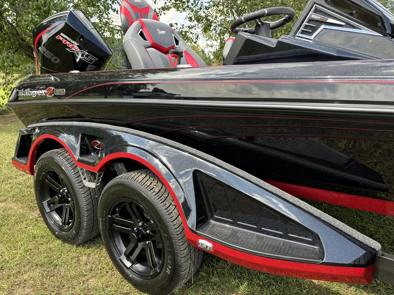 Slide: The Image of 2025 Ranger Z521R Ranger Cup boat with sleek design and dual wheels. - 11