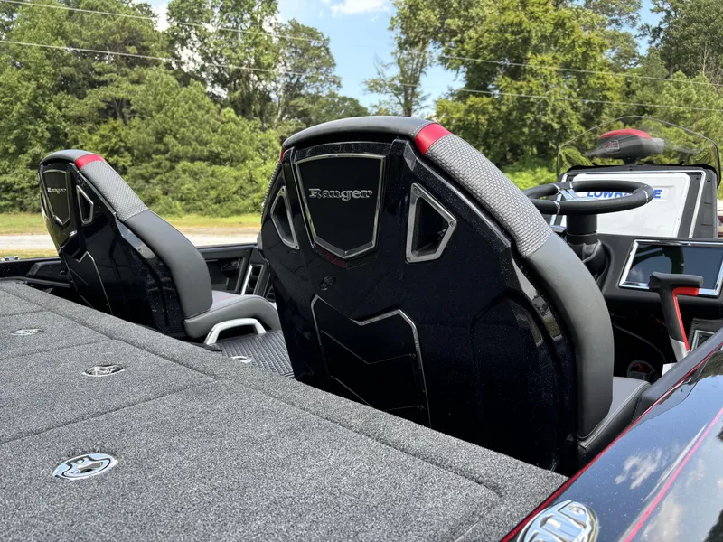 Slide: The Image of 2025 Ranger Z521R boat interior with sleek seats and modern dashboard. - 13