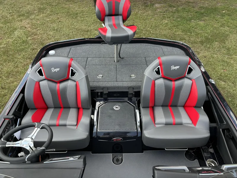 Slide: The Image of 2025 Ranger Z521R Ranger Cup boat interior with red and gray seats. - 16