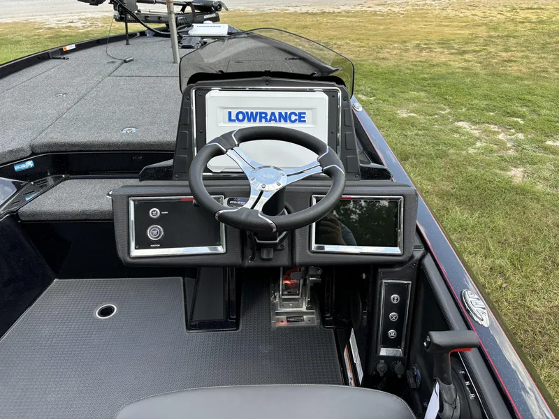 Slide: The Image of 2025 Ranger Z521R boat dashboard with Lowrance electronics and steering wheel. - 6