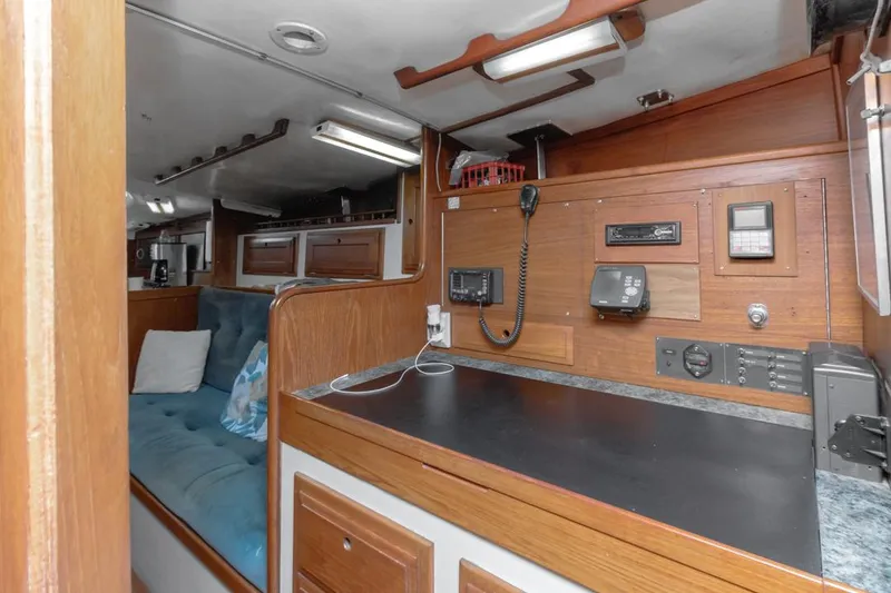 Slide: The Image of Interior of 1972 Columbia 43 Custom sailboat with navigation equipment and seating area. - 20