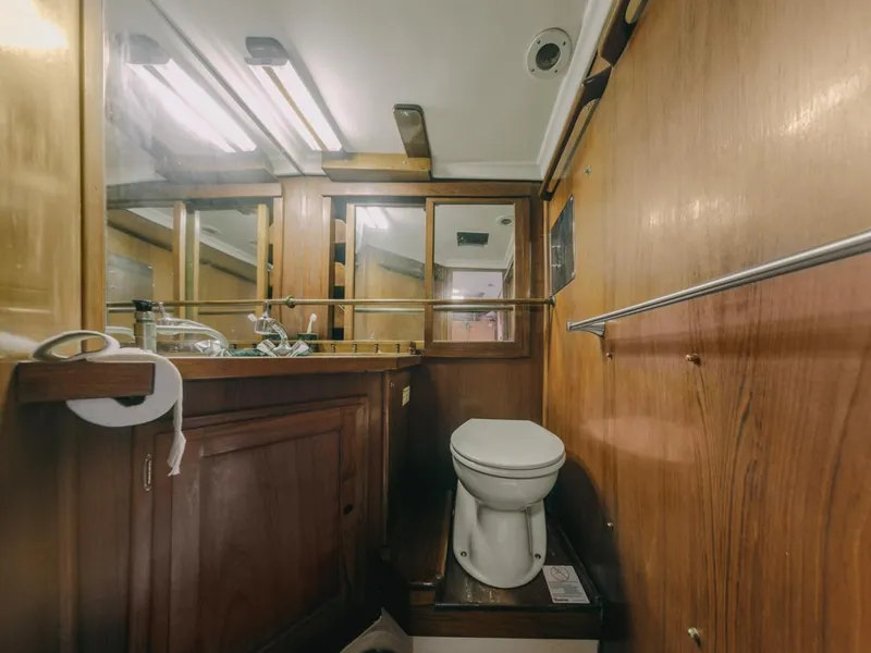 Slide: The Image of 1972 Columbia 43 Custom yacht bathroom with wooden cabinetry and modern fixtures. - 21