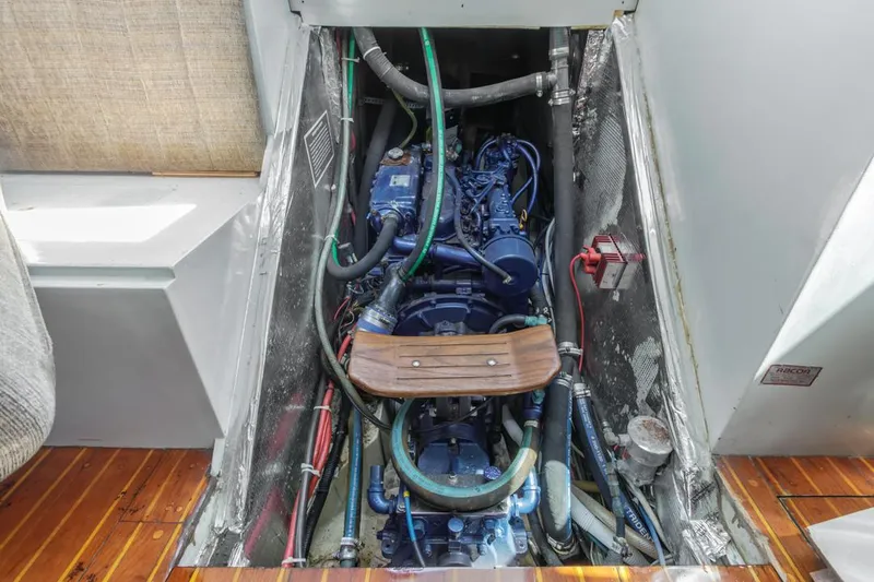 Slide: The Image of Engine compartment of a 1972 Columbia 43 Custom sailboat, showcasing detailed mechanical components. - 24