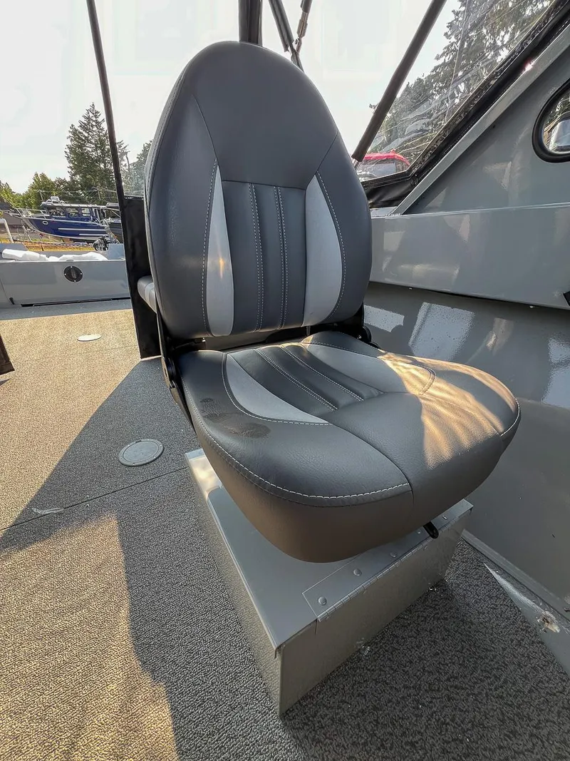 Slide: The Image of 2024 Hewescraft 200 Sportsman boat seat, gray and black upholstery, interior view. - 10