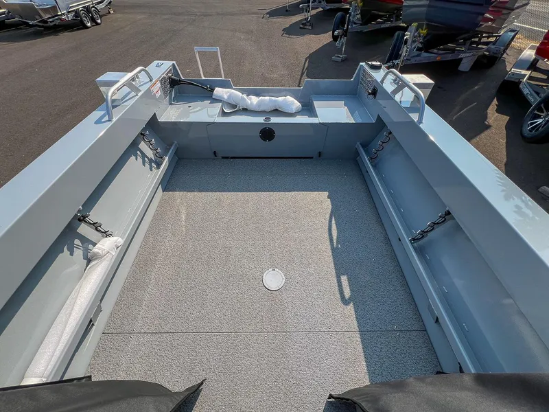 Slide: The Image of 2024 Hewescraft 200 Sportsman boat interior, spacious deck, and storage compartments. - 12