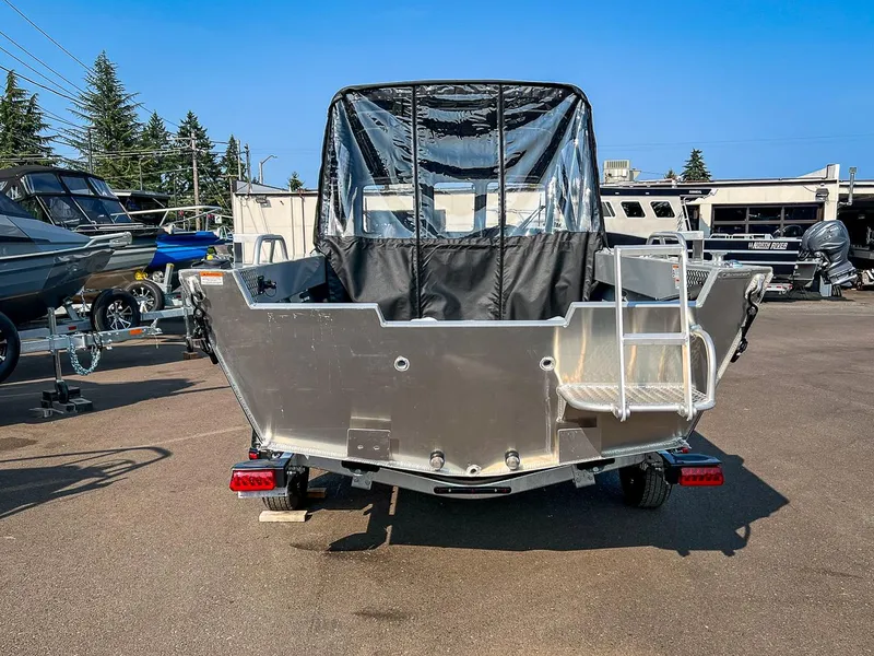 Slide: The Image of 2024 Hewescraft 200 Sportsman boat, rear view, parked outdoors. - 4