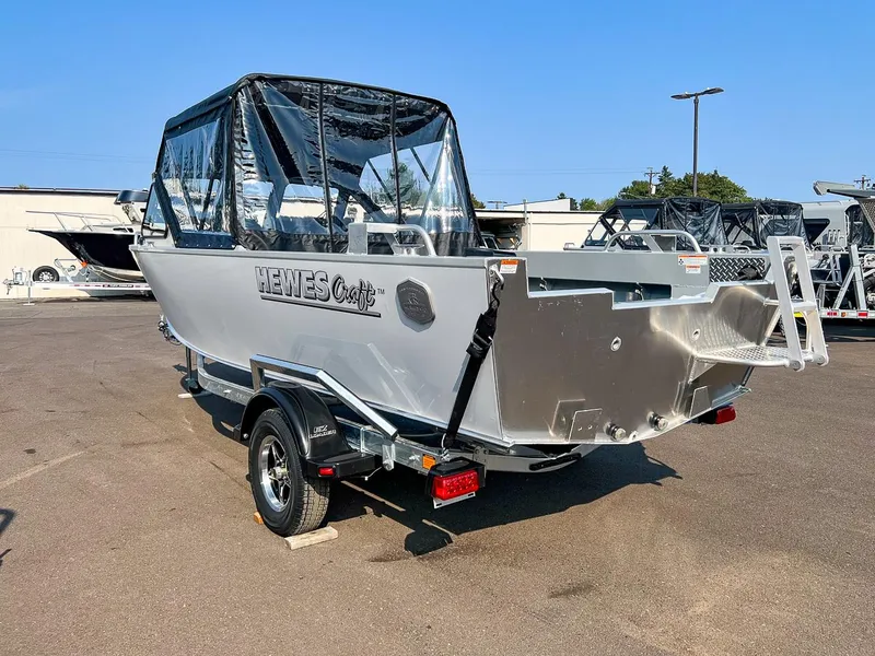 Slide: The Image of 2024 Hewescraft 200 Sportsman boat on trailer, parked outdoors. - 5