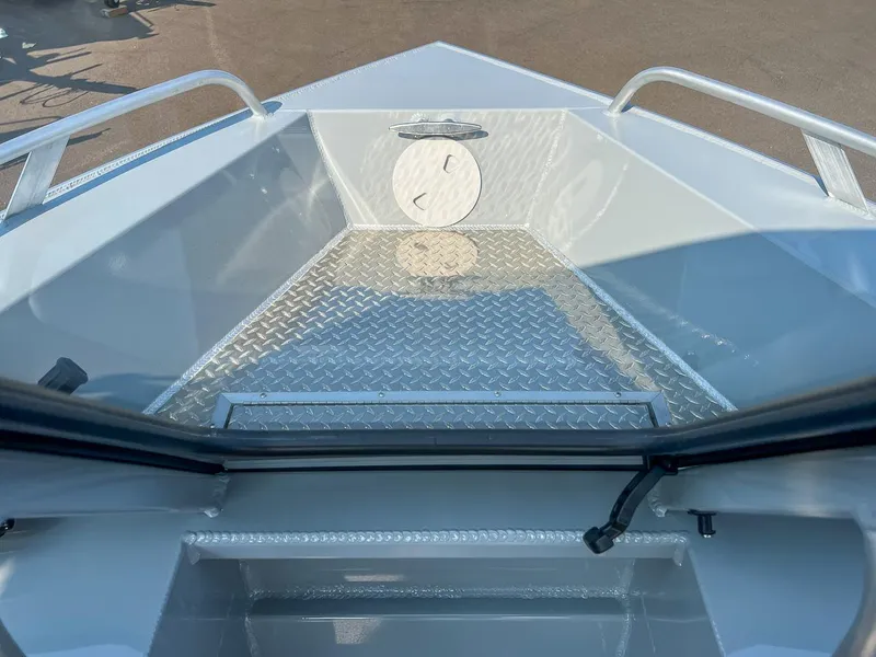 Slide: The Image of 2024 Hewescraft 200 Sportsman boat interior with diamond plate flooring. - 7