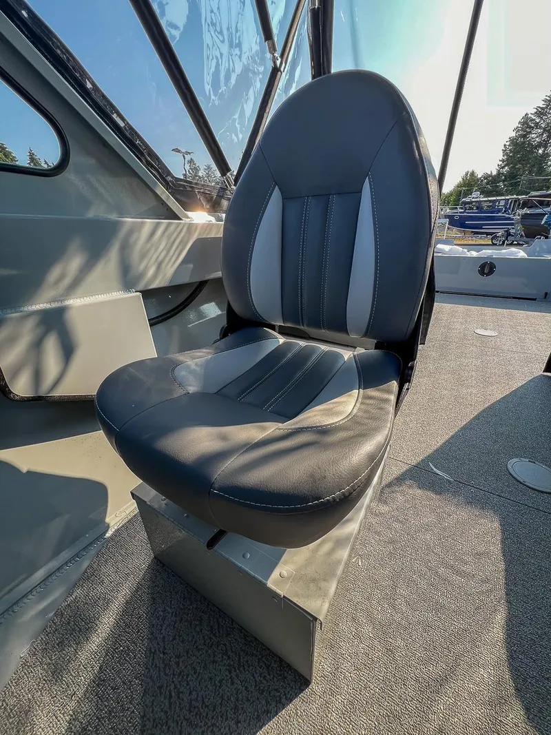 Slide: The Image of 2024 Hewescraft 200 Sportsman boat seat, black and gray upholstery, interior view. - 9