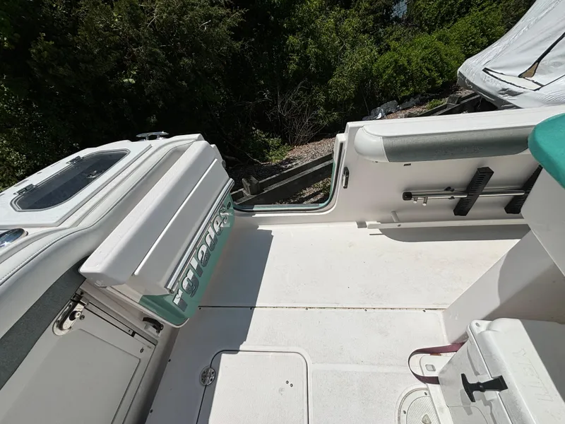 Slide: The Image of 2014 Everglades 295 boat deck with seating and storage compartments. - 14