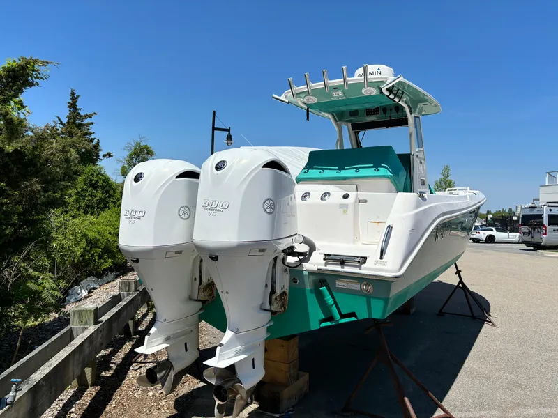 Slide: The Image of 2014 Everglades 295 boat with twin outboard engines on display. - 4