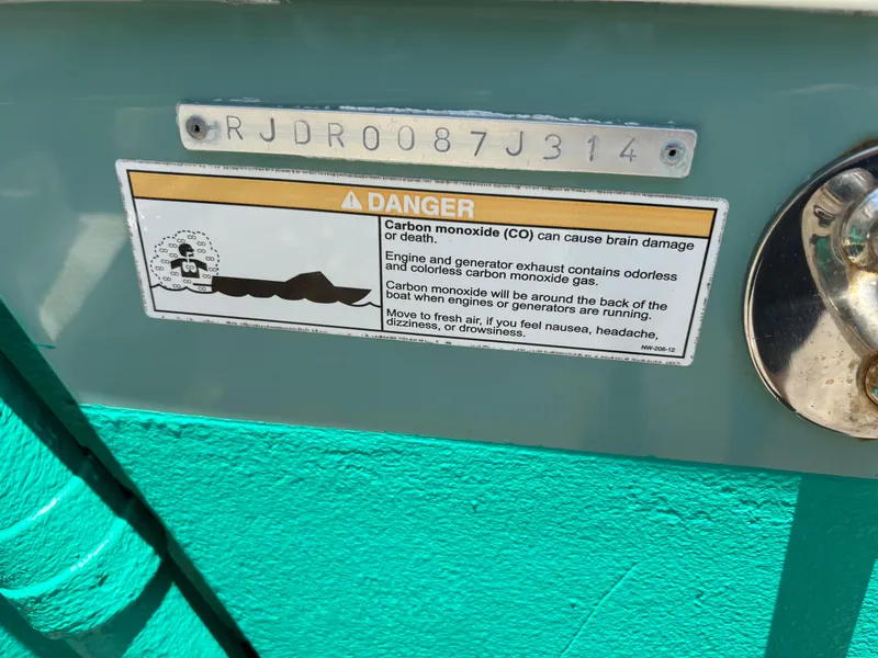Slide: The Image of Warning label on 2014 Everglades 295 boat about carbon monoxide dangers. - 5