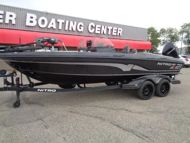 Slide: The Image of 2024 Nitro ZV21 Pro boat displayed at Tracker Boating store. - 1