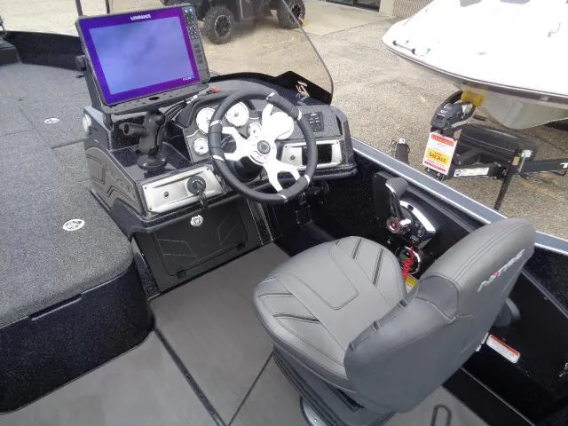 Slide: The Image of 2024 Nitro ZV21 Pro boat interior with a central seat on a carpeted deck. - 11