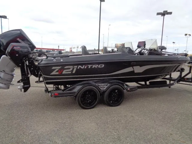 Slide: The Image of 2024 Nitro ZV21 Pro boat on trailer in outdoor setting. - 3