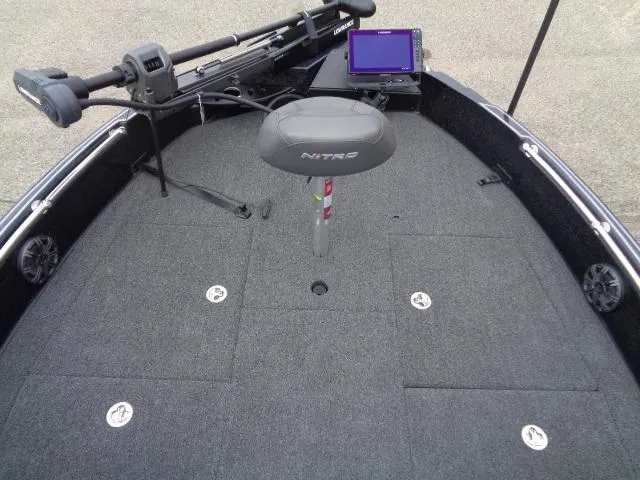 Slide: The Image of 2024 Nitro ZV21 Pro boat interior with seating and steering console. - 7