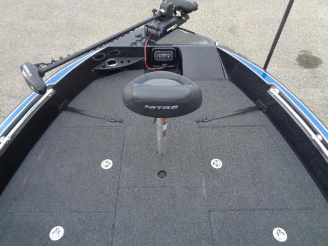 Slide: The Image of 2024 Nitro ZV20 boat with Terrova motor in snowy parking lot near boating center. - 11