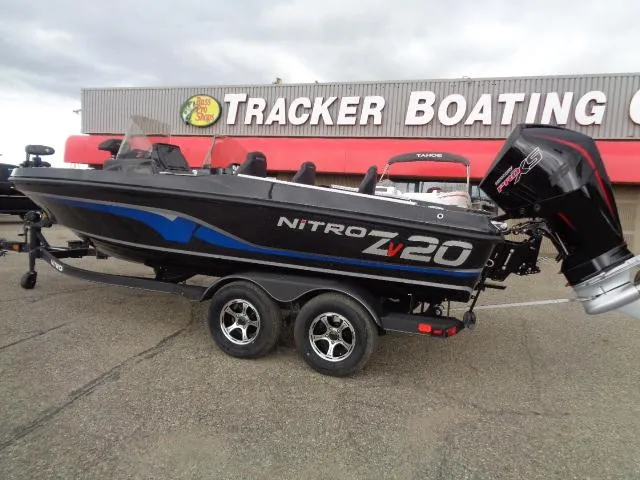 Slide: The Image of 2024 Nitro ZV20 boat on trailer in snowy outdoor setting. - 2