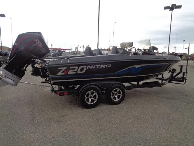 Slide: The Image of 2024 Nitro ZV20 boat on trailer in snowy parking lot. - 5