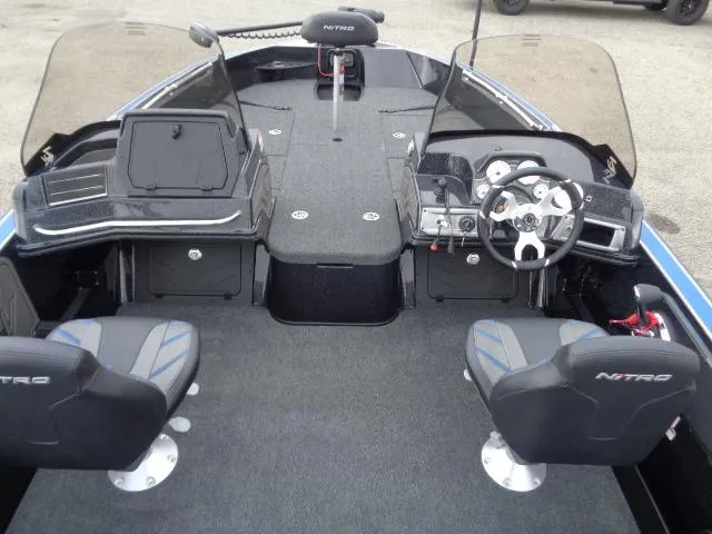 Slide: The Image of 2024 Nitro ZV20 boat interior with steering wheel, seats, and Lowrance navigation system. - 8