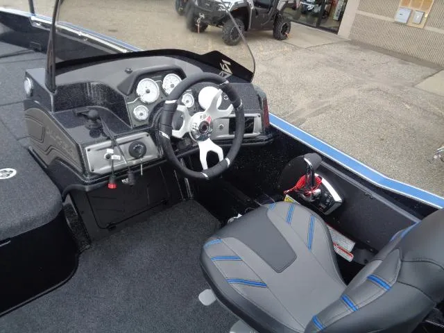 Slide: The Image of 2024 Nitro ZV20 boat dashboard with Lowrance Elite display and modern steering wheel. - 9