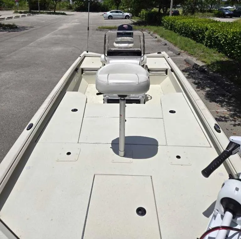 Slide: The Image of 2024 Ranger RB200 boat with elevated seat in a parking lot. - 3