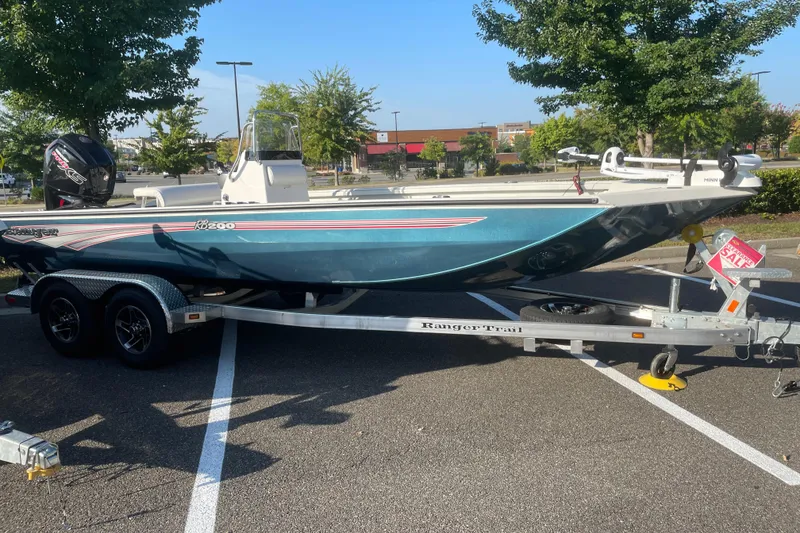 The Image of 2024 Ranger RB200 boat on trailer in parking lot. - 0