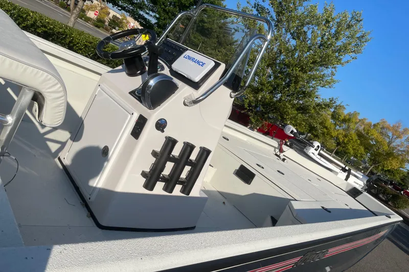 Slide: The Image of 2024 Ranger RB200 boat with steering console, outdoor setting, and clear skies. - 3