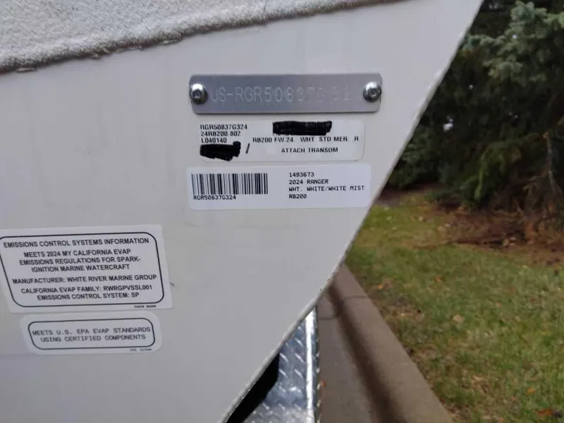 Slide: The Image of 2024 Ranger RB200 boat identification and emissions labels on hull. - 7