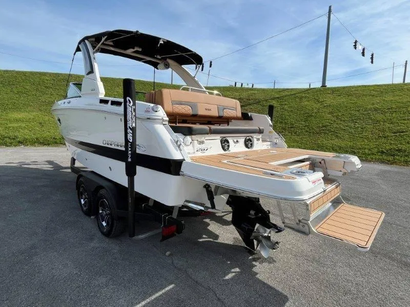 Slide: The Image of 2024 Chaparral 267 SSX boat on trailer, rear view, sunny day. - 21