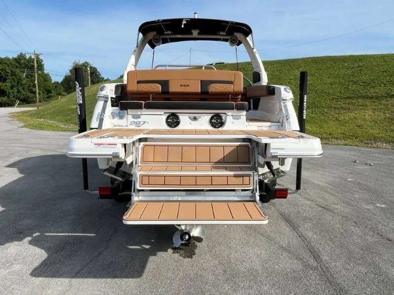 Slide: The Image of 2024 Chaparral 267 SSX boat with extended swim platform and seating. - 22