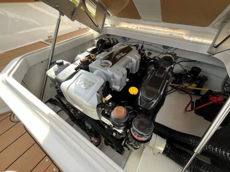 Slide: The Image of 2024 Chaparral 267 SSX engine compartment showcasing powerful V8 engine. - 23