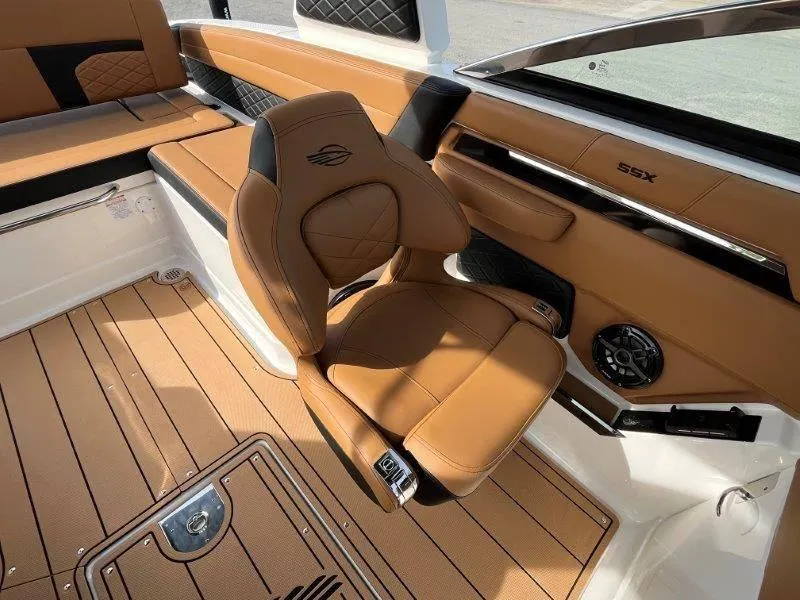 Slide: The Image of Luxurious interior of 2024 Chaparral 267 SSX boat with tan leather seating. - 26