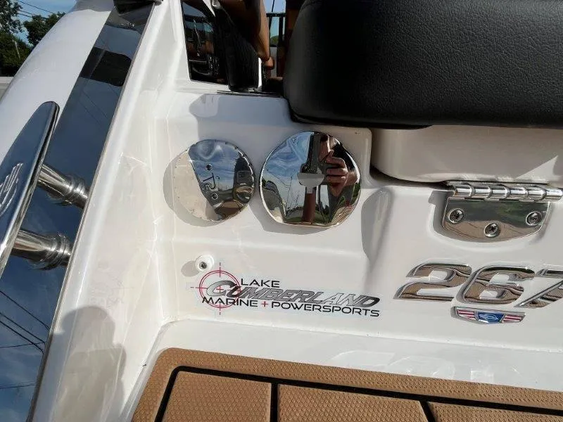 Slide: The Image of 2024 Chaparral 267 SSX boat detail with chrome accents and branding. - 29