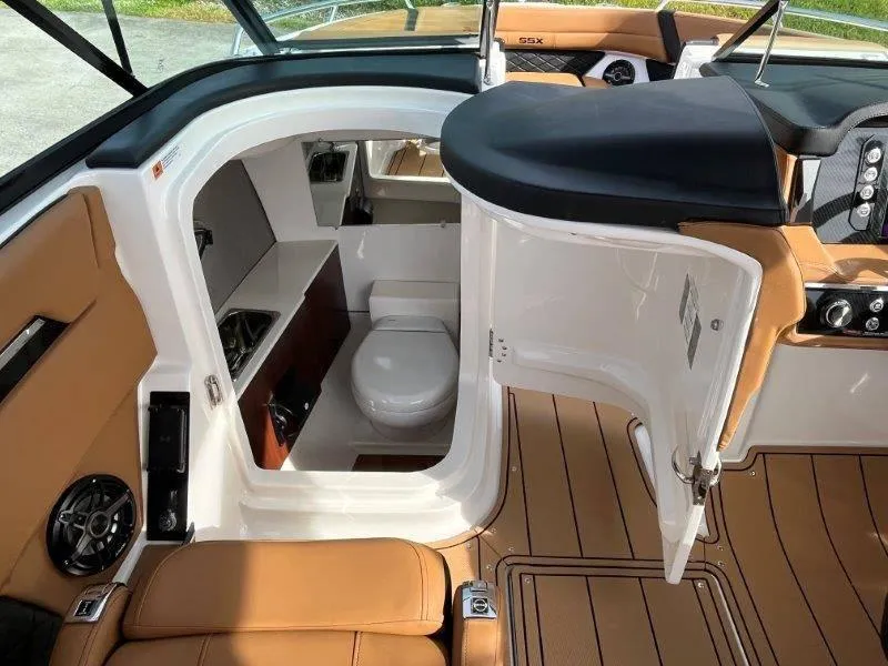 Slide: The Image of 2024 Chaparral 267 SSX boat interior with cabin and toilet. - 31