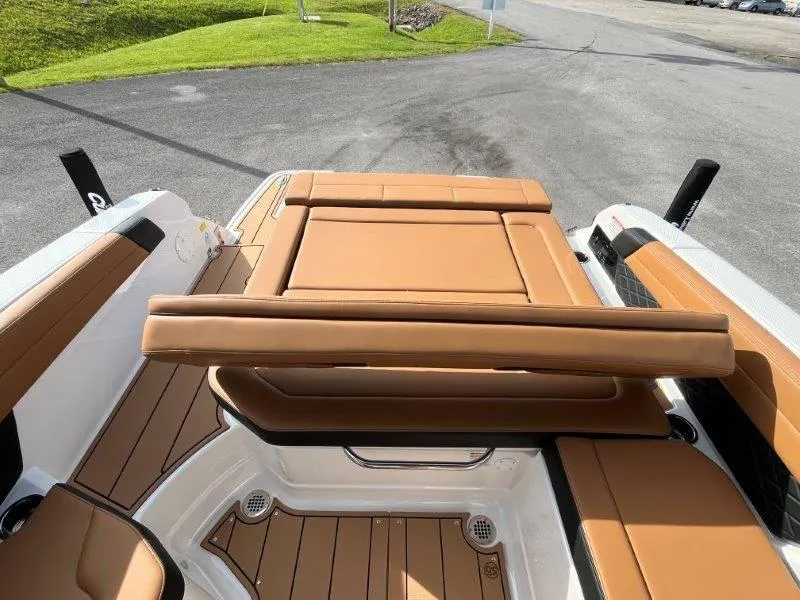 Slide: The Image of 2024 Chaparral 267 SSX boat interior with tan leather seating and sleek design. - 38