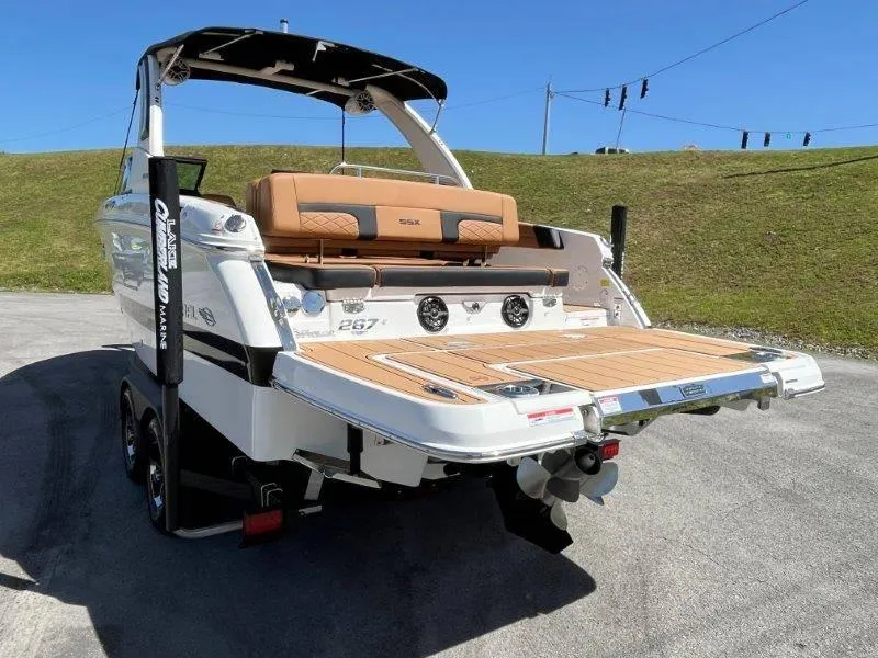 Slide: The Image of 2024 Chaparral 267 SSX boat rear view with swim platform and seating. - 4