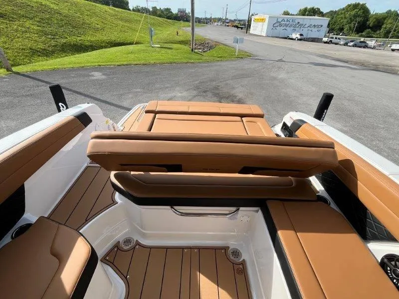 Slide: The Image of 2024 Chaparral 267 SSX boat interior with tan seating and sleek design. - 42