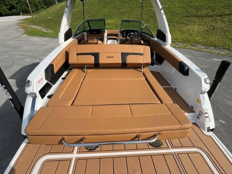 Slide: The Image of 2024 Chaparral 267 SSX boat with luxurious tan seating and sleek design. - 47