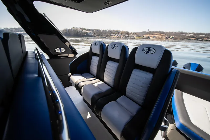 Slide: The Image of 2025 Cigarette 42 Auroris boat interior with luxurious seating on a calm water backdrop. - 22