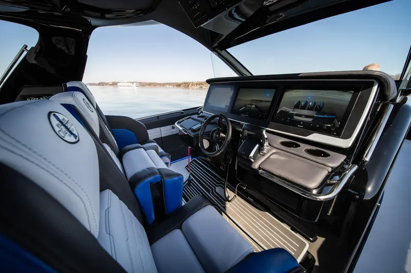 Slide: The Image of Interior of 2025 Cigarette 42 Auroris boat with modern dashboard and seating. - 26